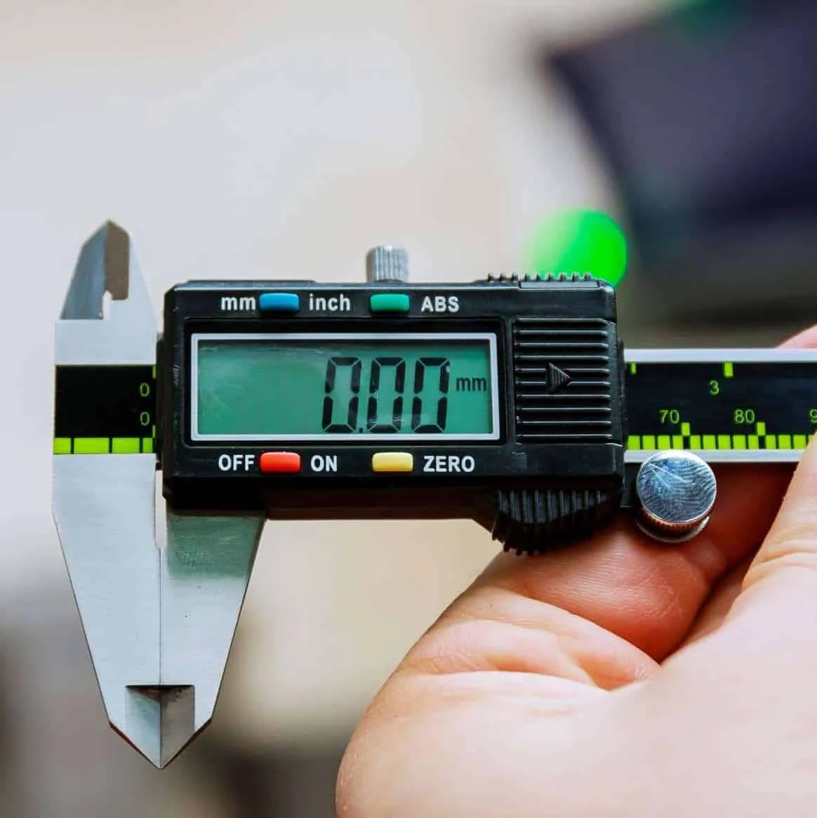 Digital caliper measuring a precision component